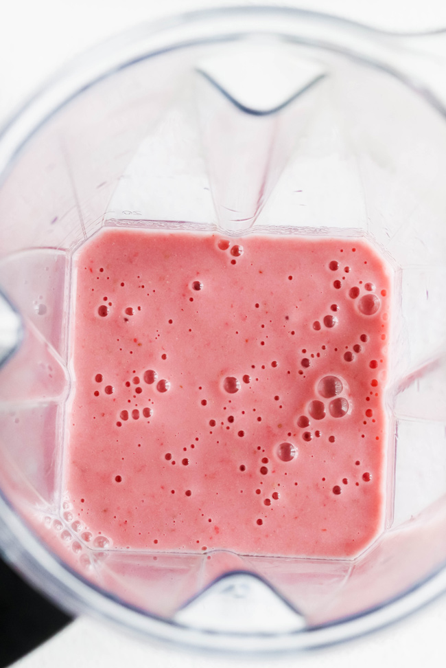 Blended strawberries, vanilla, cashew cream, water, and sweetener in a Vitamix.