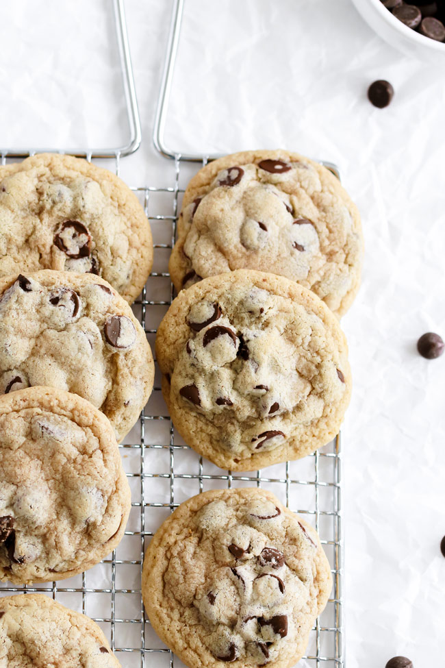 Gluten-free and dairy-free chocolate chip cookies on a cooling rack.